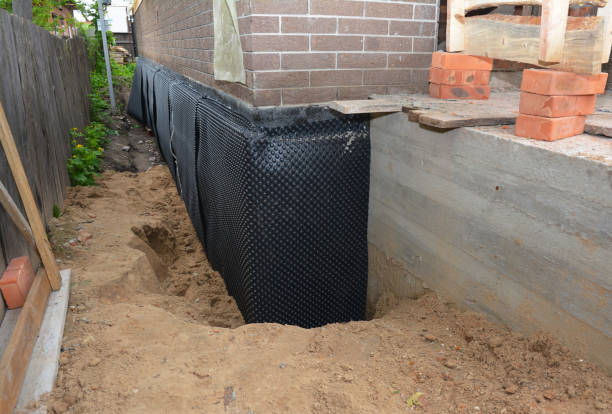 Happy homeowners after waterproofing job in Pulaski